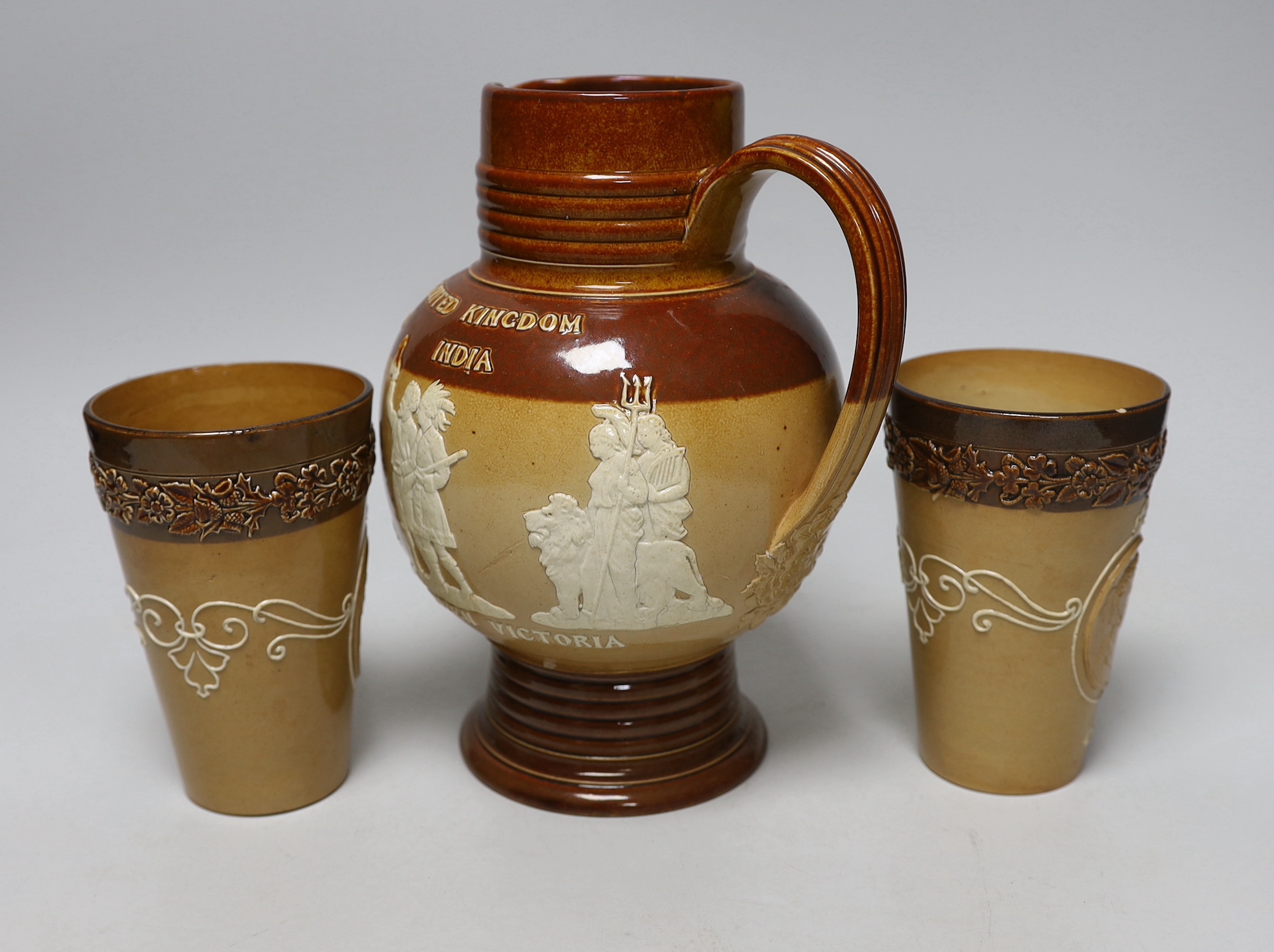 A Doulton stoneware jug and two tumblers, tallest 22cm